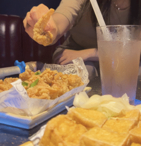 Action shot of appetizers at solo karaoke