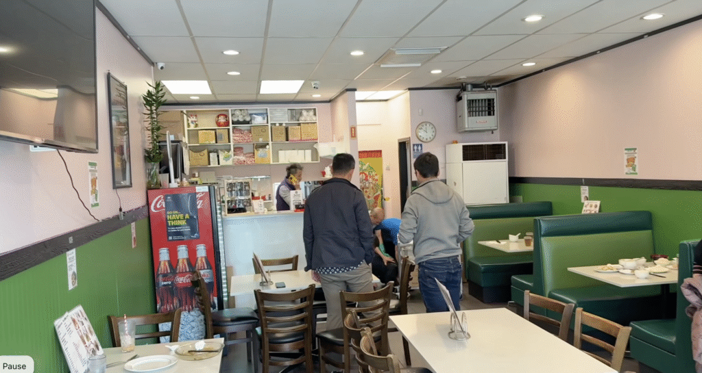 crowd gathers around fight at Mui Garden